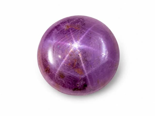 Rare Star Ruby gemstone showing natural asterism six-ray star.