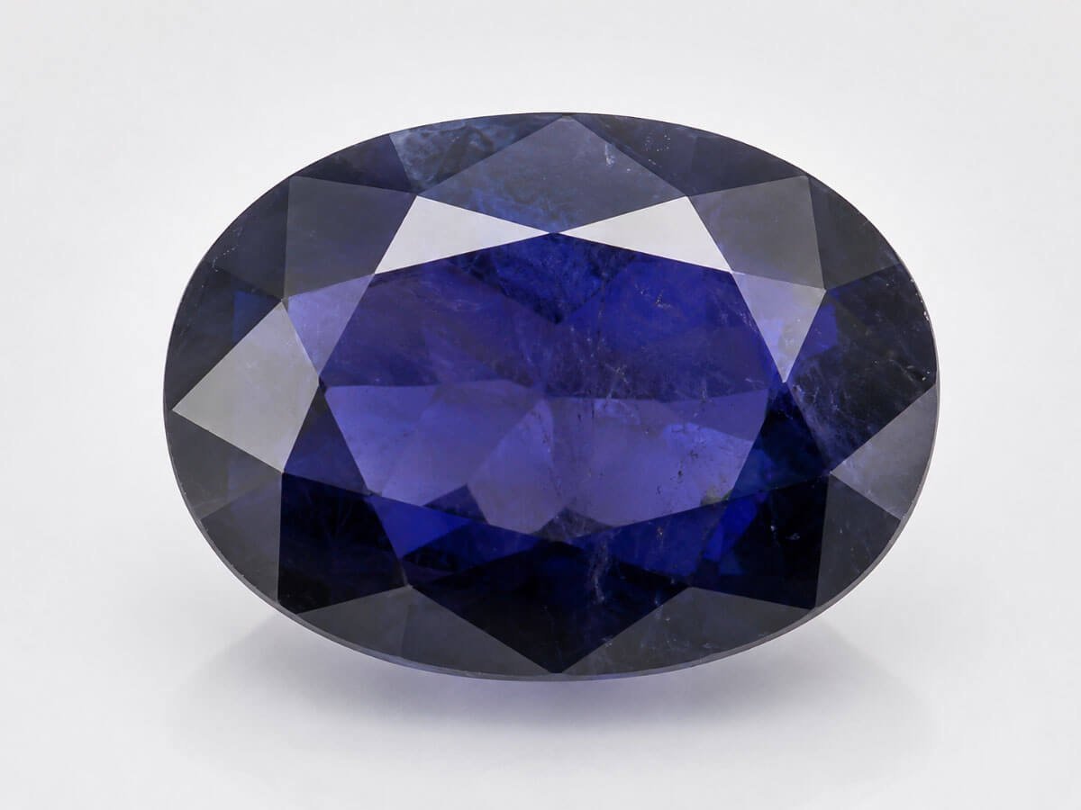 Violet-blue Iolite (Neeli) gemstone for intuition and Saturn balance.