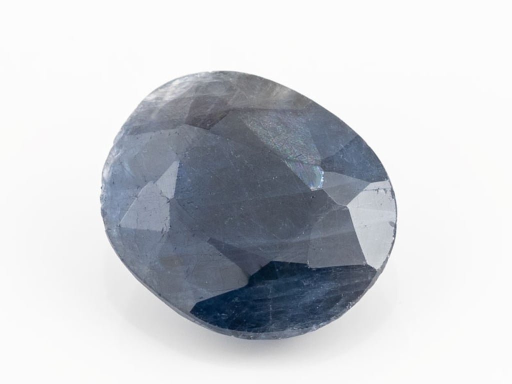 African Blue Sapphire Neelam 10.20 Carat top view, deep blue oval mix cut