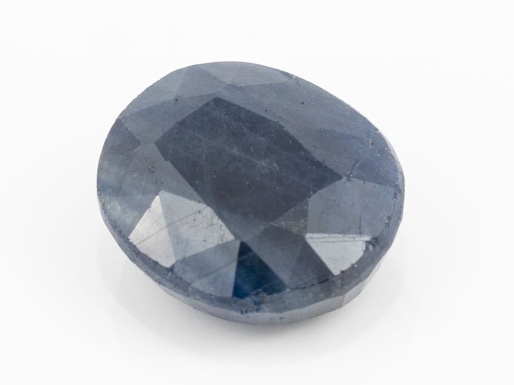African Blue Sapphire Neelam 10.90 Carat top view, deep blue oval mix cut