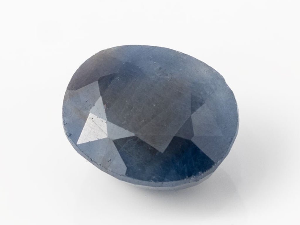 African Blue Sapphire Neelam 11.33 Carat top view, deep blue oval mix cut