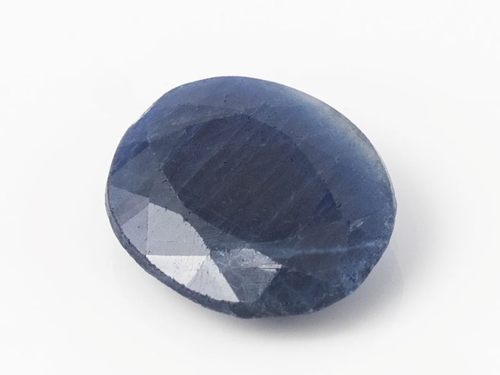 African Blue Sapphire Neelam 5.48 Carat top view, deep blue oval mix cut