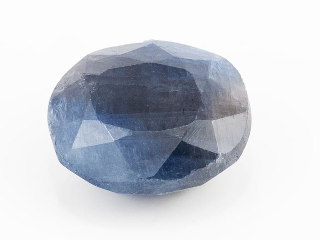 African Blue Sapphire Neelam 5.92 Carat top view, deep blue oval mix cut