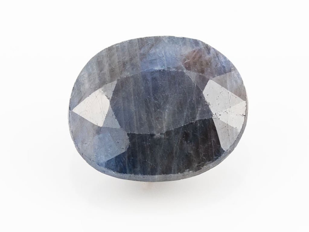 African Blue Sapphire Neelam 5.99 Carat top view, deep blue oval mix cut