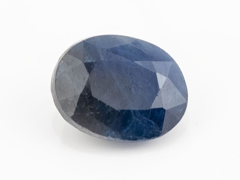 African Blue Sapphire Neelam 6.66 Carat top view, deep blue oval mix cut