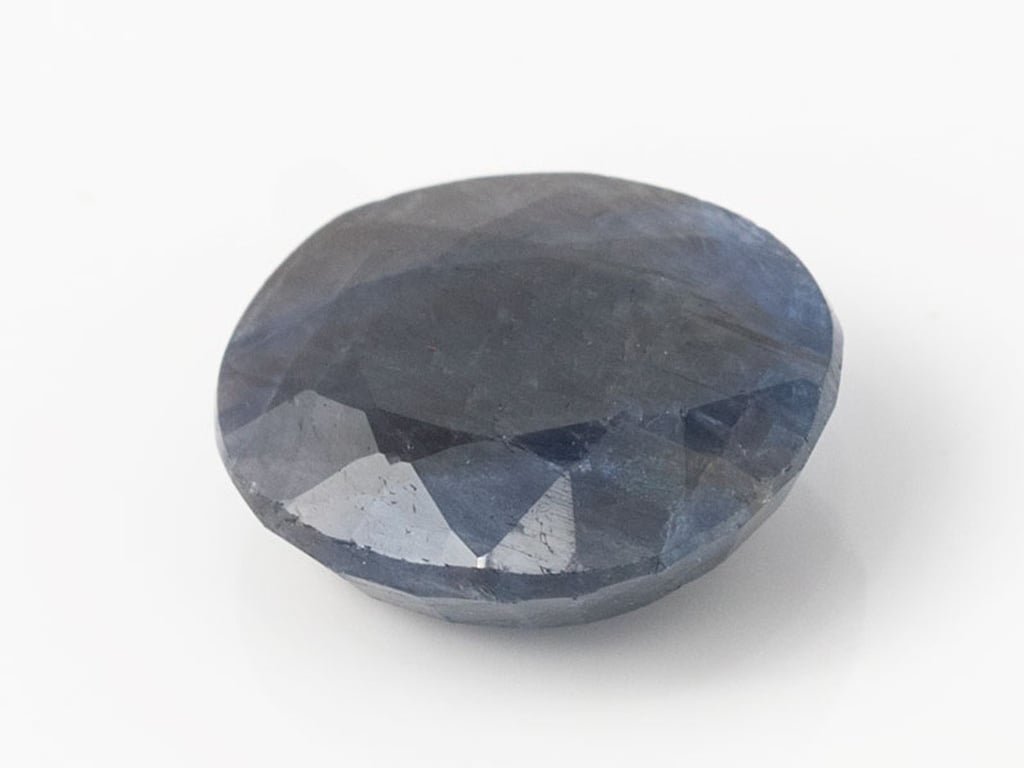African Blue Sapphire Neelam 6.75 Carat top view, deep blue oval mix cut