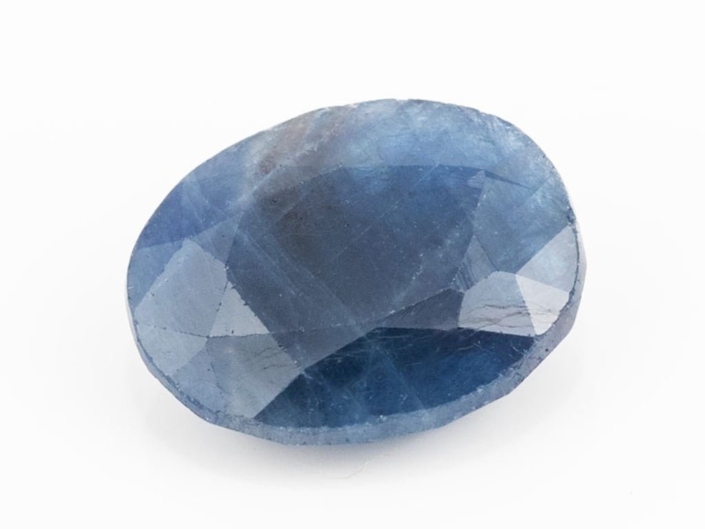 African Blue Sapphire Neelam 7.38 Carat top view, deep blue oval mix cut
