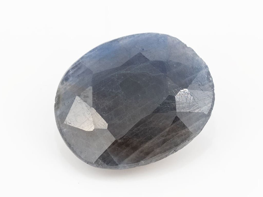 African Blue Sapphire Neelam 7.42 Carat top view, deep blue oval mix cut