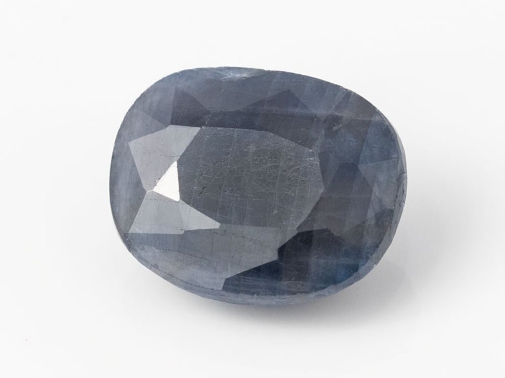 African Blue Sapphire Neelam 9.18 Carat top view, deep blue oval mix cut