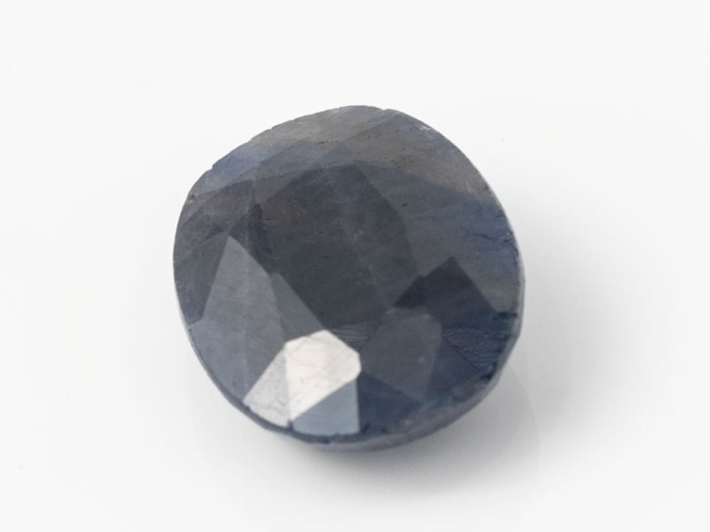 African Blue Sapphire Neelam 9.18 Carat top view, deep blue oval mix cut
