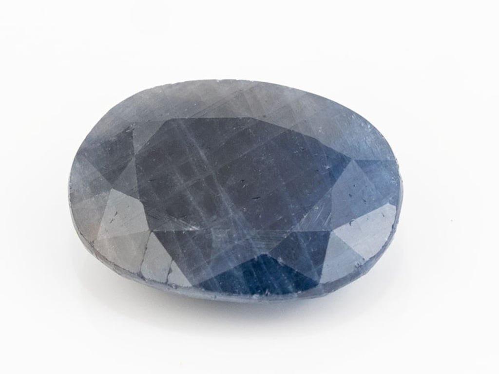 African Blue Sapphire Neelam 9.53 Carat top view, deep blue oval mix cut