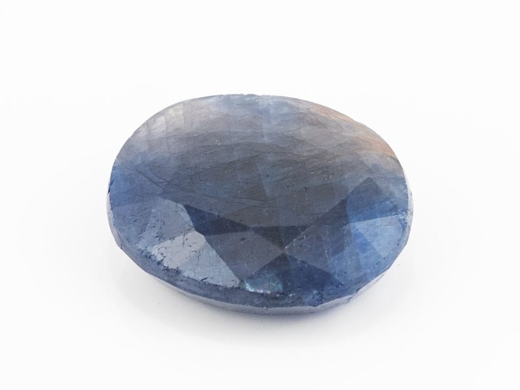 African Blue Sapphire Neelam 9.64 Carat top view, deep blue oval mix cut