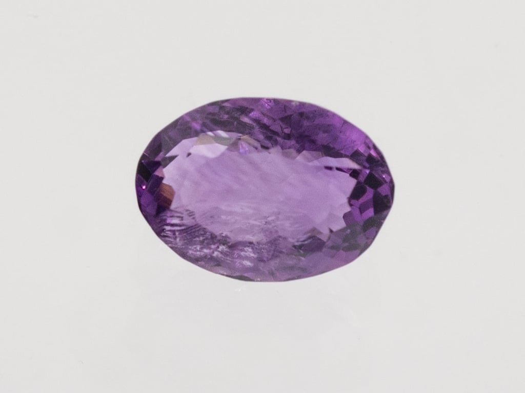 Natural Amethyst (Jamunia) 3.99 carat, top face-up view showing purple color and oval shape