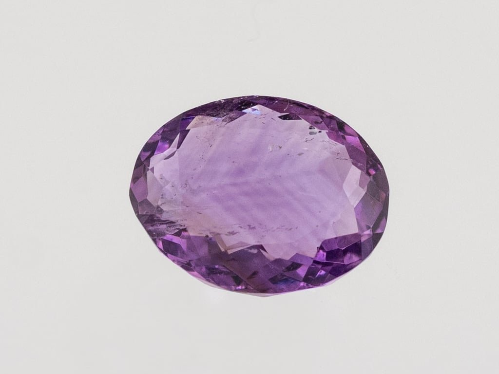 Natural Amethyst (Jamunia) 4.20 carat, top face-up view showing purple color and oval shape