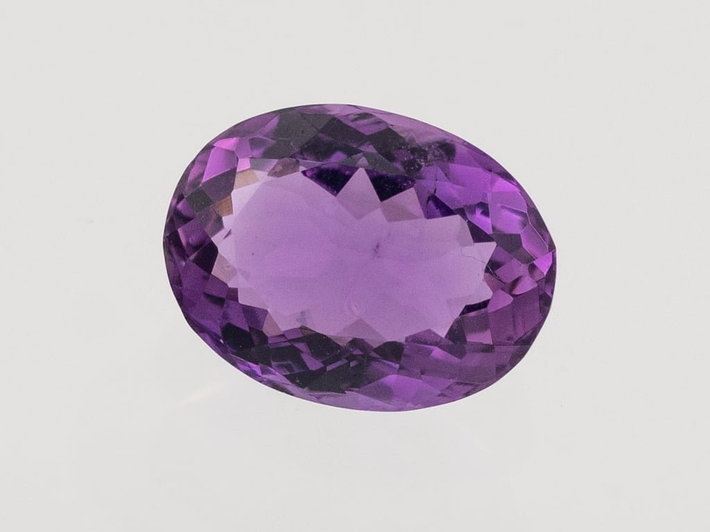 Natural Amethyst (Jamunia) 4.80 carat, top face-up view showing purple color and oval shape