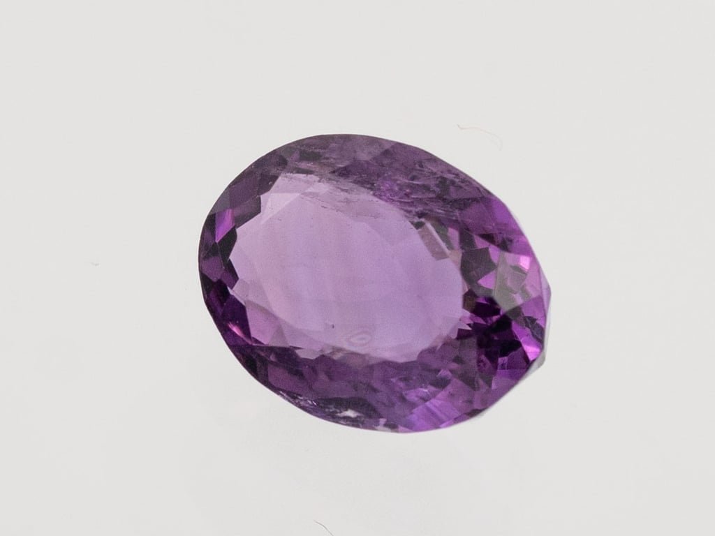 Natural Amethyst (Jamunia) 4.89 carat, top face-up view showing purple color and oval shape