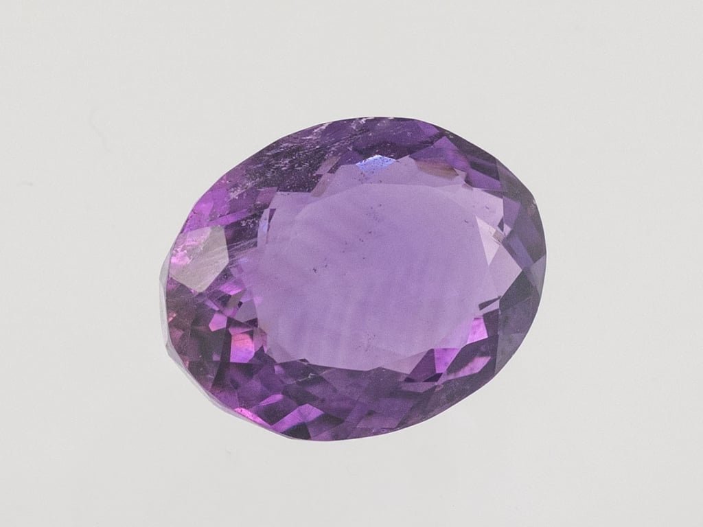 Natural Amethyst (Jamunia) 4.95 carat, top face-up view showing purple color and oval shape