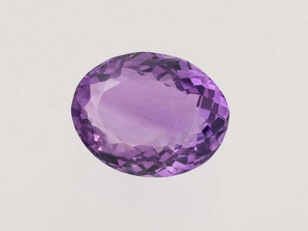 Natural Amethyst (Jamunia) 5.01 carat, top face-up view showing purple color and oval shape