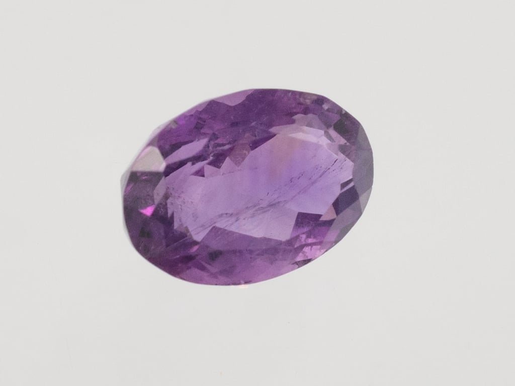 Natural Amethyst (Jamunia) 5.24 carat, top face-up view showing purple color and oval shape