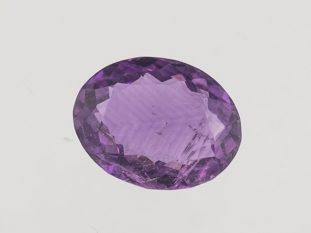 Natural Amethyst (Jamunia) 5.38 carat, top face-up view showing purple color and oval shape