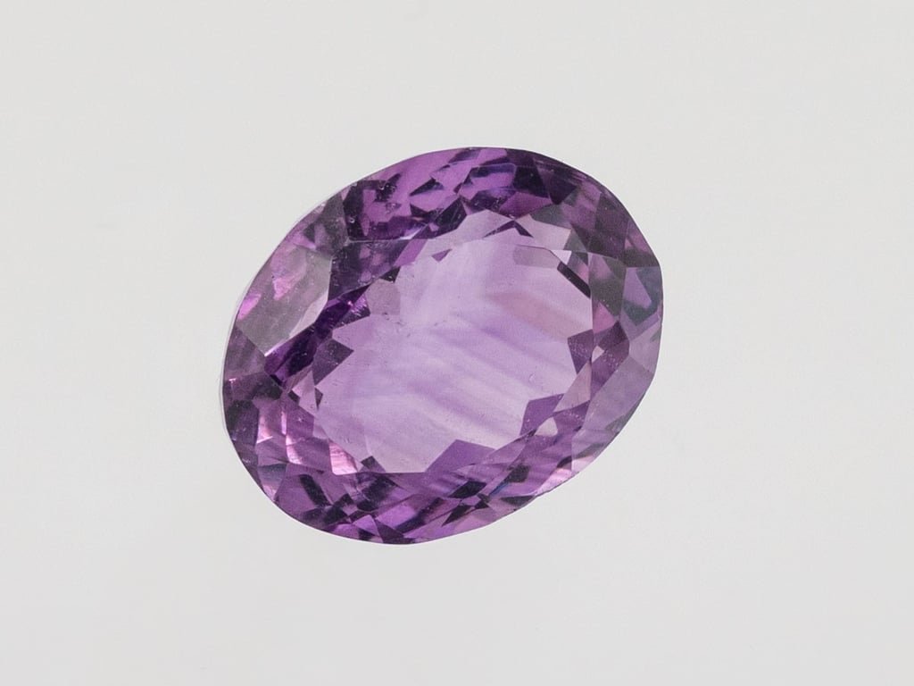 Natural Amethyst (Jamunia) 5.46 carat, top face-up view showing purple color and oval shape