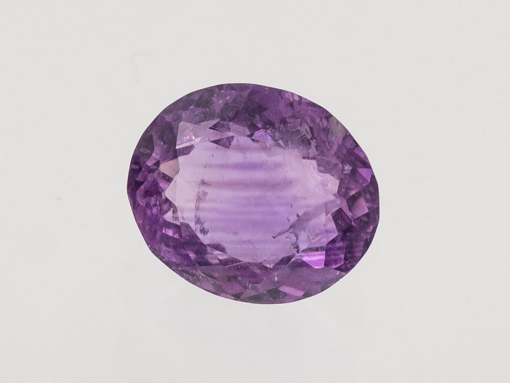 Natural Amethyst (Jamunia) 5.47 carat, top face-up view showing purple color and oval shape