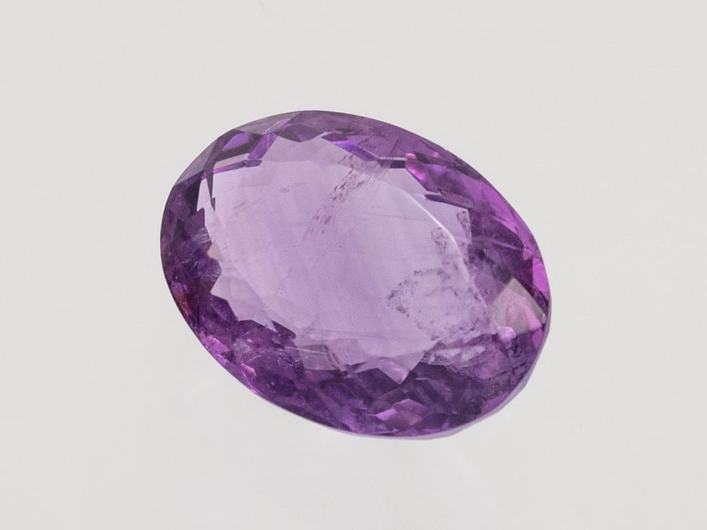 Natural Amethyst (Jamunia) 5.89 carat, top face-up view showing purple color and oval shape