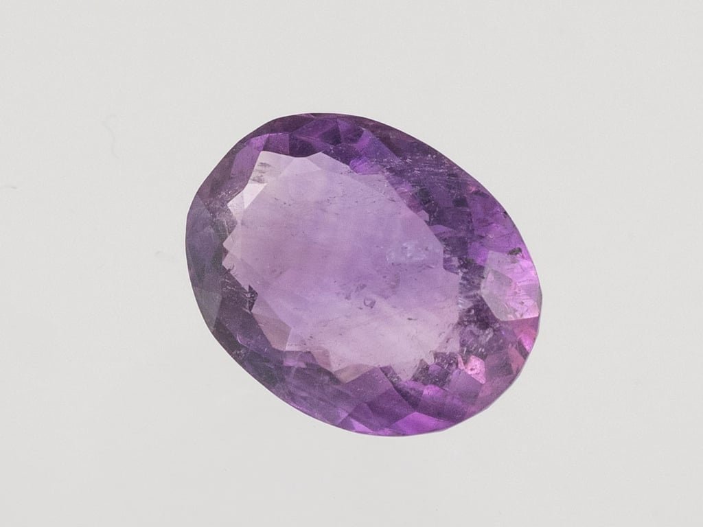 Natural Amethyst (Jamunia) 6.12 carat, top face-up view showing purple color and oval shape