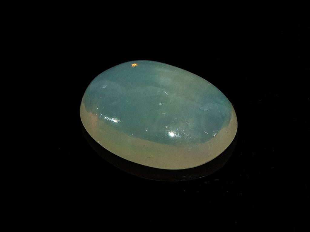 Natural Australian Opal Stone 3.94 Carat top view: translucent body with a soft blue sheen