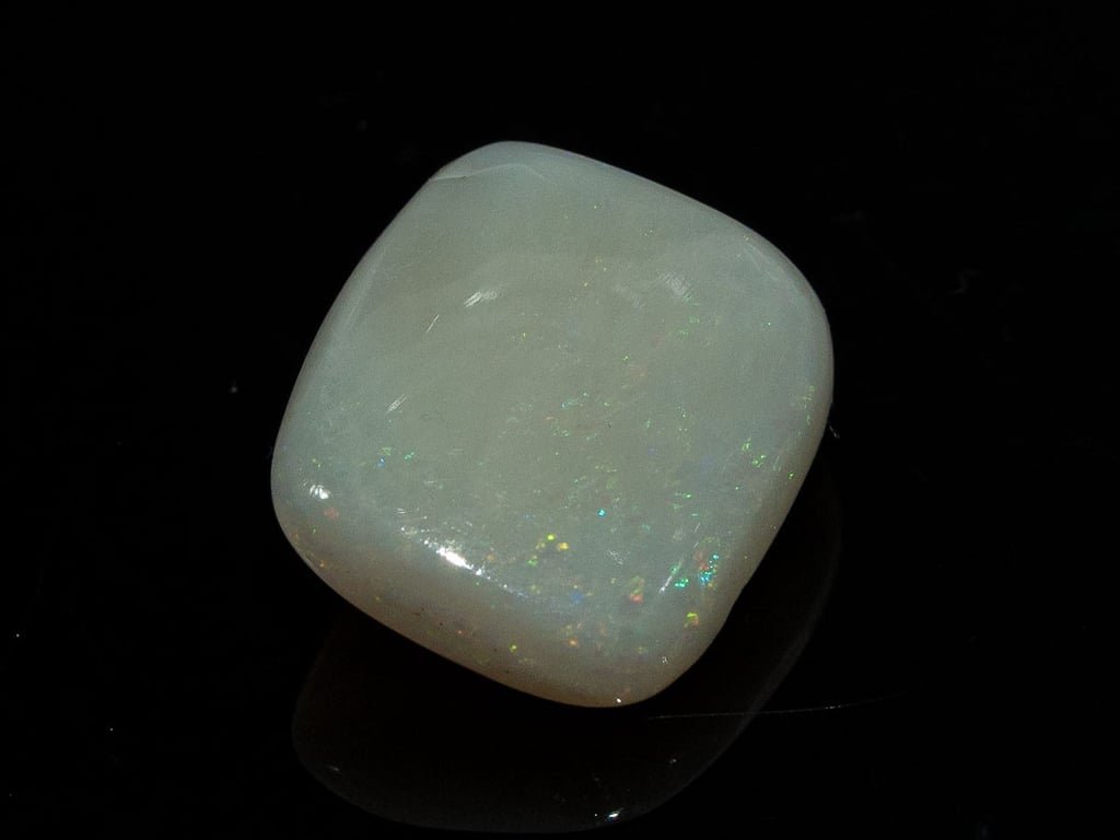 Natural Australian White Opal Stone 5.75 Carat top view: grey-white body with fine multicoloured pinpoint flashes