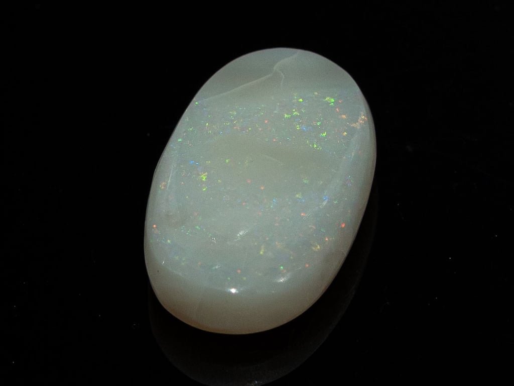 Natural Australian White Opal Stone 7.25 Carat top view: white body with scattered multicoloured pinpoint flashes