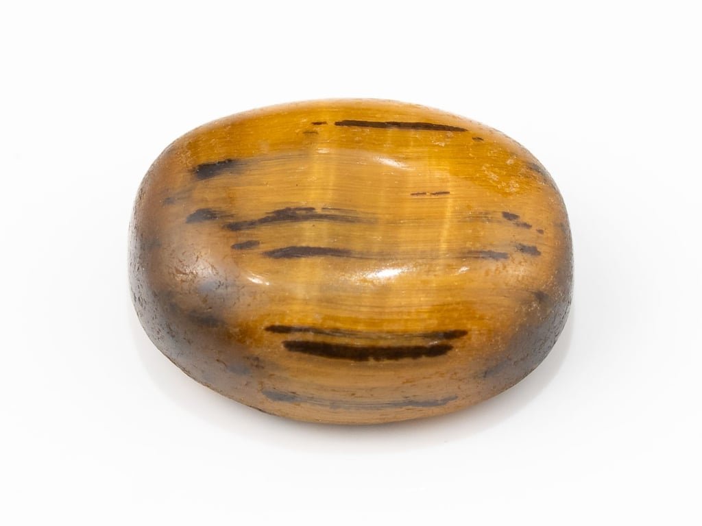 Tiger Eye Stone (Chitti) 10.19 carat, top view, golden brown oval cabochon with its band of light