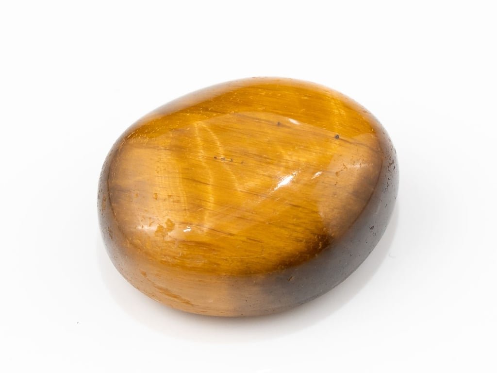 Tiger Eye Stone (Chitti) 10.41 carat, top view, golden brown oval cabochon with its band of light