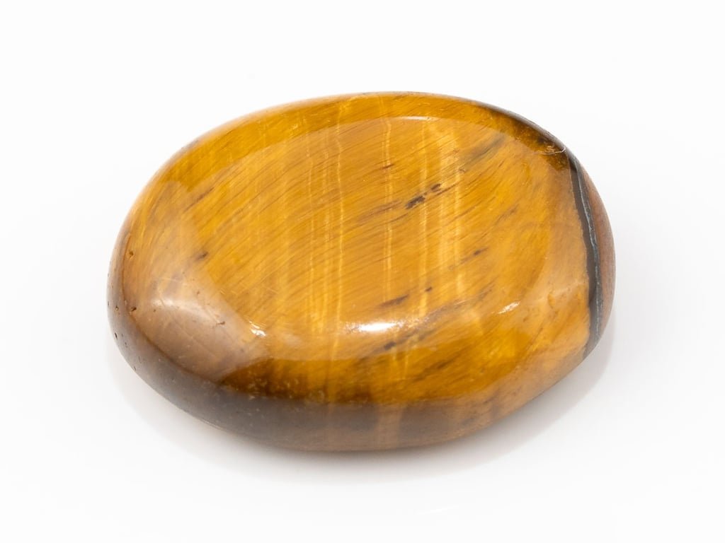 Tiger Eye Stone (Chitti) 10.70 carat, top view, golden brown oval cabochon with its band of light