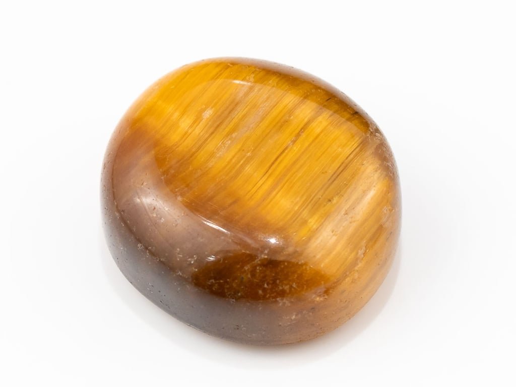Tiger Eye Stone (Chitti) 11.64 carat, top view, golden brown oval cabochon with its band of light