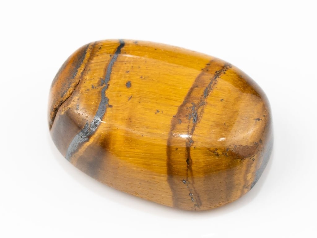 Tiger Eye Stone (Chitti) 13.77 carat, top view, golden brown oval cabochon with its band of light