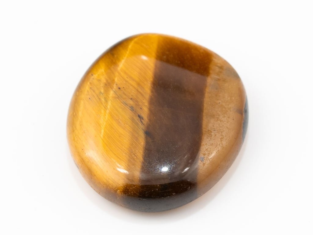 Tiger Eye Stone (Chitti) 8.16 carat, top view, golden brown oval cabochon with its band of light