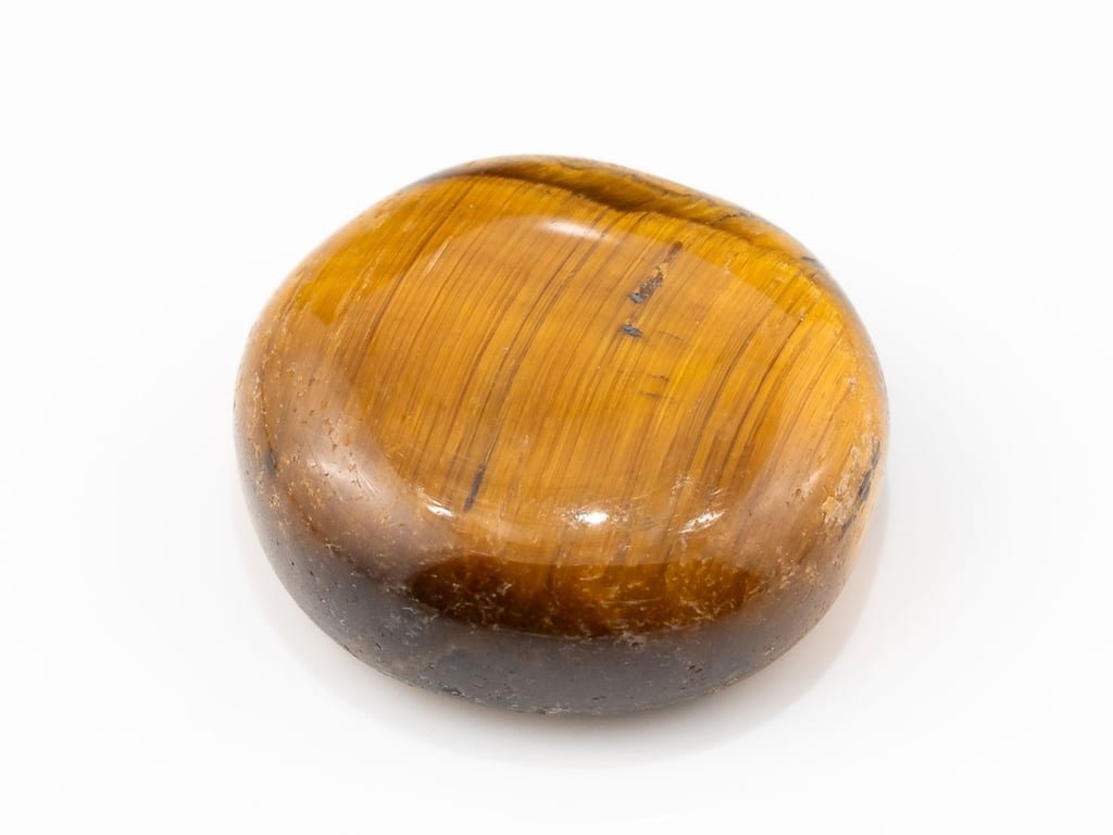 Tiger Eye Stone (Chitti) 9.37 carat, top view, golden brown oval cabochon with its band of light