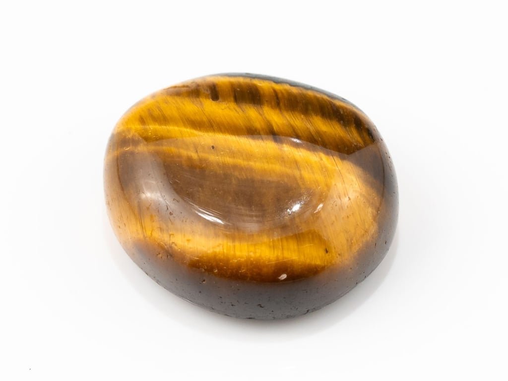 Tiger Eye Stone (Chitti) 9.49 carat, top view, golden brown oval cabochon with its band of light
