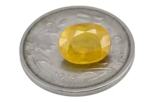 Reference size view of Yellow Sapphire (Pukhraj) 4.775 Carat (5.25 Ratti) - Bangkok