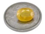 Reference size view of Yellow Sapphire (Pukhraj) 5.025 Carat (5.52 Ratti) - Bangkok