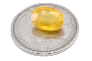 Reference size view of Yellow Sapphire (Pukhraj) 6.130 Carat (6.75 Ratti) - Bangkok