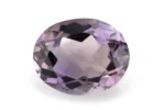 High-resolution image of the Original Amethyst Stone 4.87 Carat (5.35 Ratti) Jamunia showcasing its vibrant blue-purple hues and flawless oval cut.