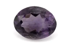 High-resolution image of the Original Amethyst Stone 6.19 Carat (6.80 Ratti) Jamunia showcasing its vibrant blue-purple hues and flawless oval cut.