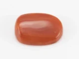 Moonga Stone 5.71 Ratti - Red Coral Stone showcasing vibrant red color and oval-capsule cut