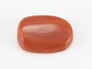 Moonga Stone 5.71 Ratti - Red Coral Stone showcasing vibrant red color and oval-capsule cut