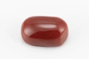 Moonga Stone 6.05 Ratti - Red Coral Stone showcasing vibrant red color and oval-capsule cut