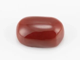 Moonga Stone 6.05 Ratti - Red Coral Stone showcasing vibrant red color and oval-capsule cut