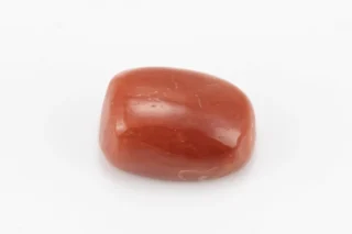 Moonga Stone 6.08 Ratti - Red Coral Stone showcasing vibrant red color and oval-capsule cut