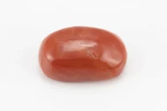 Moonga Stone 6.12 Ratti - Red Coral Stone showcasing vibrant red color and oval-capsule cut